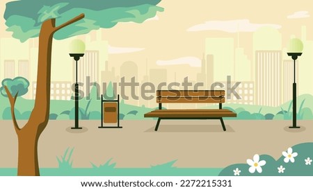 Behind the park there is a view of the city.  At the background there is a bank, bin and a lightning pole. At the right bottom of picture there are white leaves flowers. The weather is sunny and warm.