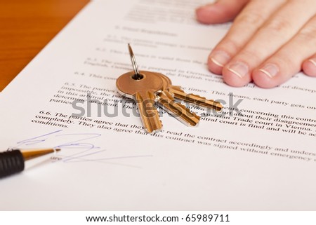 Handing over of keys after contract signing of house sale. Isolated on white background.
