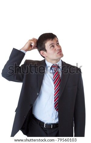 Businessman scratches his head and looks up doubtfully.Isolated on white background.