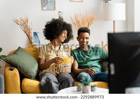 Similar – Image, Stock Photo Diverse couple chilling on floats