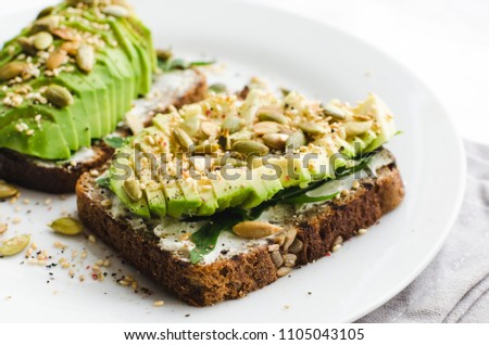 Similar – Image, Stock Photo healthy vegetarian breakfast, avocado toast with cucumber, eggs, tomato and greean salad on wholegrain bread