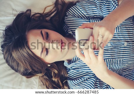 Similar – Image, Stock Photo Teenage girl lying in a blue armchair