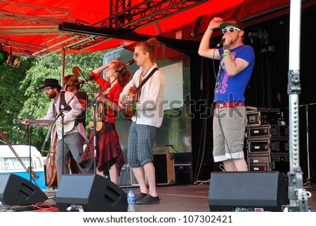 TENTERDEN, ENGLAND - JUNE 30: Coco and The Butterfields, British acoustic Fip Fok band, perform at the Tentertainment music festival on June 30, 2012 at Tenterden, Kent, England.