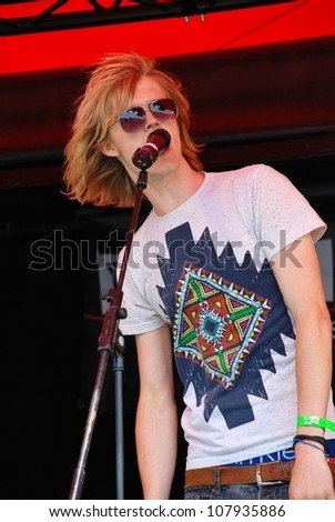 TENTERDEN, ENGLAND - JUNE 30: Max Davenport, lead singer of British indie band Out Side Room (now Propellers), performs at the annual Tentertainment music festival on June 30, 2012 at Tenterden, Kent.
