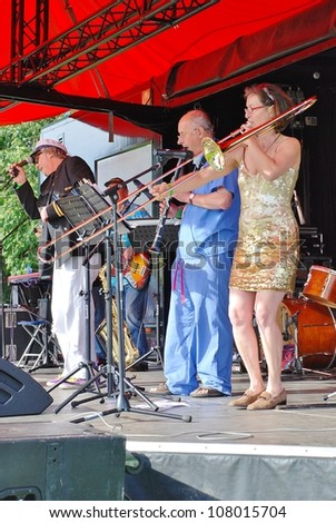 TENTERDEN, ENGLAND - JUNE 30: The Trouser Trumpets, British novelty jazz/dance band, perform at the Tentertainment music festival on June 30, 2012 in Tenterden, Kent. The event was first held in 2008.