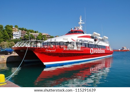 ALONISSOS, GREECE - SEPTEMBER 27: Hellenic Seaways catamaran ferry Flying Cat 5 moored at Patitiri harbour on September 27, 2012 at Alonissos island, Greece. The catamaran was built in Norway in 1996.