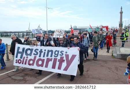 HASTINGS, ENGLAND - MAY 30, 2015: Protestors take part in a march along the seafront to demonstrate against austerity measures and Government cutbacks after the Conservatives won the General Election.