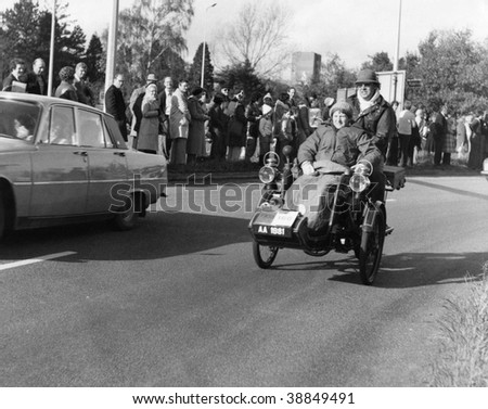 HORLEY, ENGLAND-NOVEMBER 6: A vintage vehicle takes part in the London-Brighton Veteran Car Run on November 6, 1977 in Horley, Surrey. The 86k run is the world longest running motoring event.