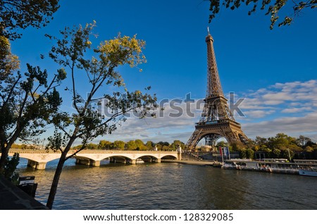 Eiffel Tower in Paris, France - overlooking Seine river at sunset