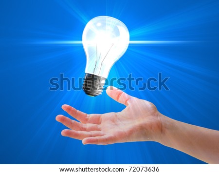 Light bulb hovering over palm of a hand, symbol of help or inspiration