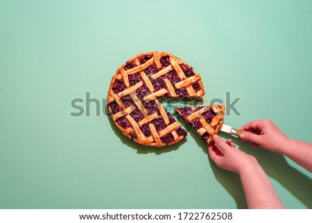 Similar – Image, Stock Photo Grabbing slice of cake. Raspberry pie with lattice top