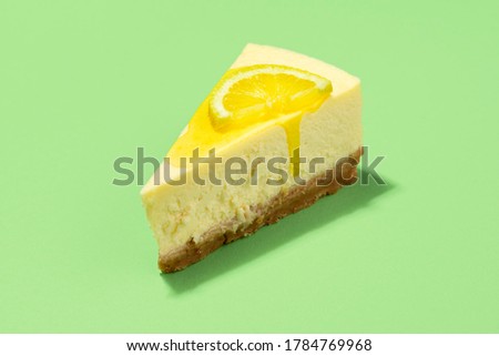 Similar – Image, Stock Photo Cheesecake slice with lemon syrup topping. Slice of cheesecake close-up