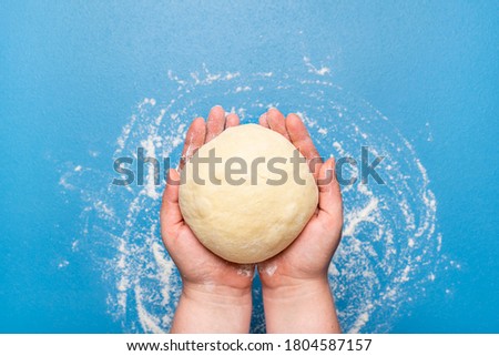 Similar – Image, Stock Photo Making doughnuts flat lay. Uncooked raw dough prepared for donuts