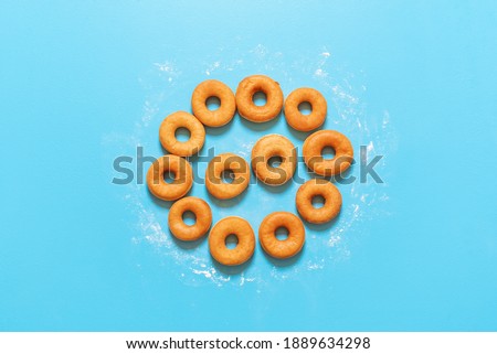 Similar – Image, Stock Photo Donuts aligned in a circle shape. Homemade fresh doughnuts, top view