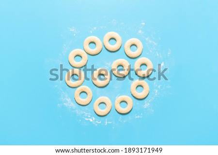 Similar – Image, Stock Photo Donuts aligned in a circle shape. Homemade fresh doughnuts, top view