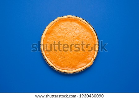 Similar – Image, Stock Photo Pumpkin pie home-baked, above view. Sliced pie isolated on a colorful background