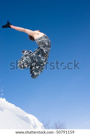 man jumping off a cliff