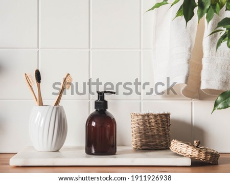 Mockup for bathing products in the bathroom, spa shampoo, shower gel, liquid soap with a towel beside and various accessories