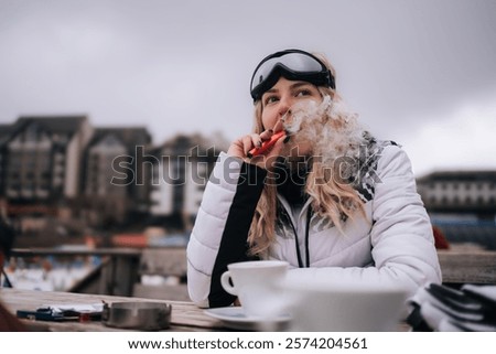 Similar – Image, Stock Photo Modern relaxed woman vaping while sitting on marked road