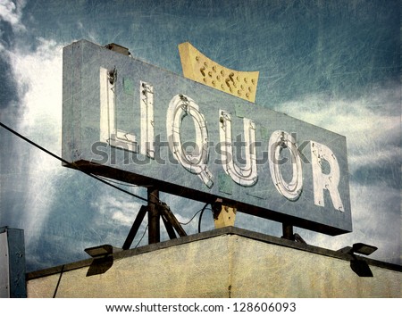 aged and worn vintage liquor store sign