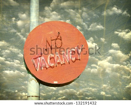 aged and worn vintage photo of no vacancy neon sign