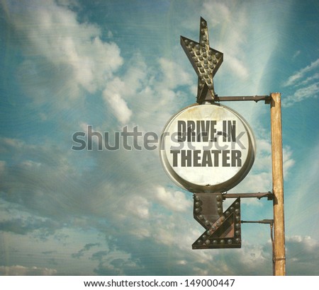 aged and worn vintage drive-in theater sign