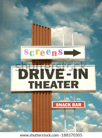 aged and worn vintage photo of retro drive in theater sign