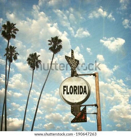aged and worn vintage photo of Florida sign with palm trees