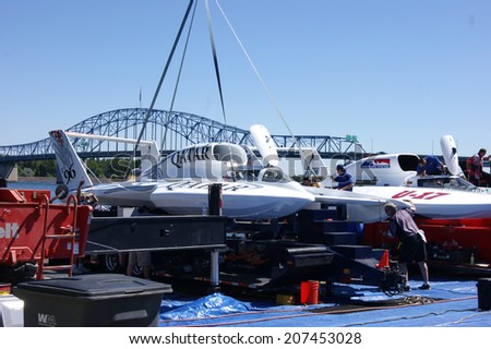 KENNEWICK, WA - JULY 25 : Hydroplane racing boat being lowered by a crane during Tri-Cities Water Follies annual event