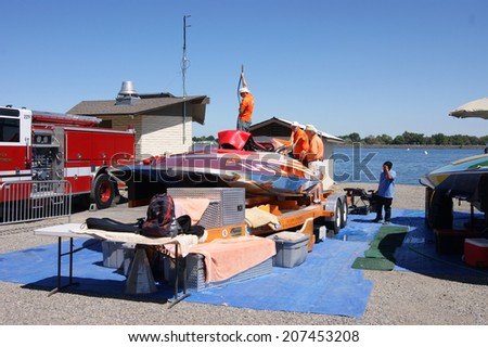KENNEWICK, WA - JULY 25 : Hydroplane racing boat being worked on by mechanics during Tri-Cities Water Follies annual event