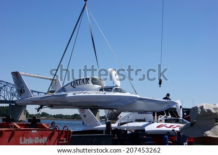 KENNEWICK, WA - JULY 25 : Hydroplane racing boat being lifted by a crane during Tri-Cities Water Follies annual event
