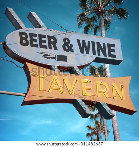 aged and worn vintage photo of beer and wine tavern neon sign