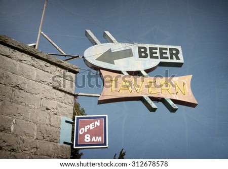 aged and worn vintage photo of beer tavern neon sign