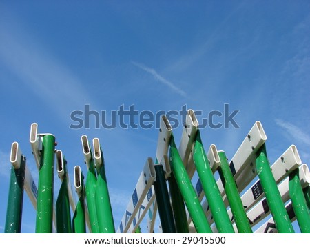 Green Metal Track Hurdles and Blue Sky