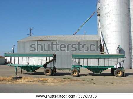 Truck trailer in front of grain silo