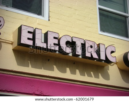 electric sign on yellow building