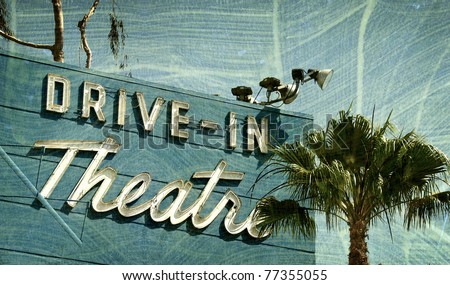 aged and worn vintage photo  of drive in theater
