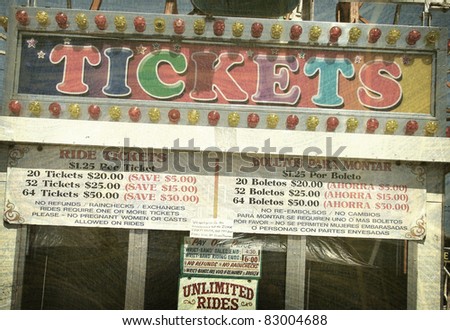 aged and worn vintage photo of ticket booth at carnival