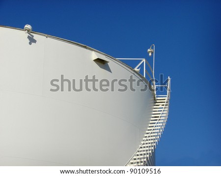 industrial tank with ladder and blue sky