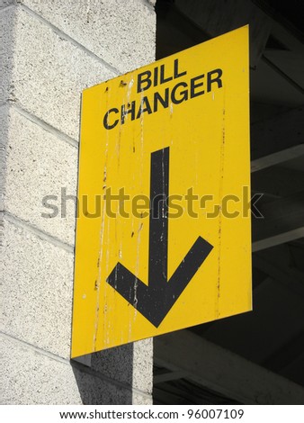 bill changer machine sign with arrow