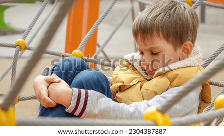 Similar – Image, Stock Photo portrait one sad little boy sitting near a window