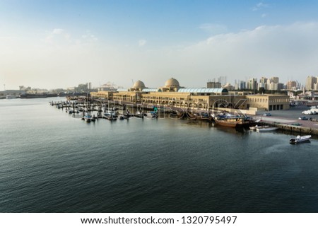 Aerial View of souq al jubail and port of sharjah with boats docked at pier