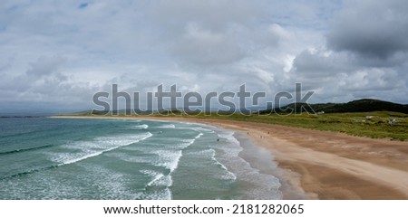 A panorama aerial view of the golden sand beach and turquoise waters of the beach at Narin-Portnoo Stok fotoğraf © 