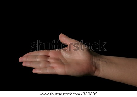 hand holding invisible object - deep black background