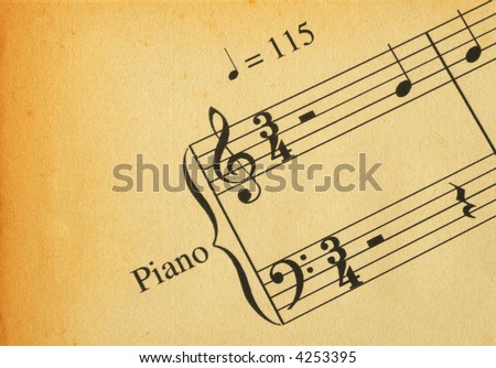 close-up of retro music note on yellowed paper