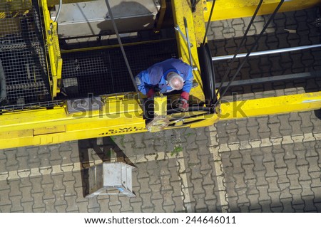 DUISBURG, GERMANY - 17 April 2014 Portal-crane servicing on automatic spreader in Logistics Center - Logport Duisburg