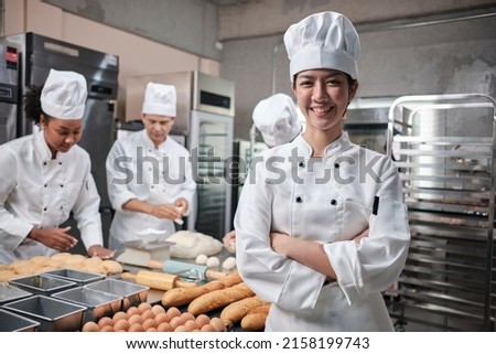 Similar – Image, Stock Photo Kitchen staff in Asian cafe