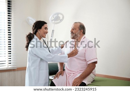 Female doctors in uniform healthy check White male patients in examination coat by stethoscope, and checkups and advise health care diagnosis at clinic hospital, and appointments visit. Foto stock © 