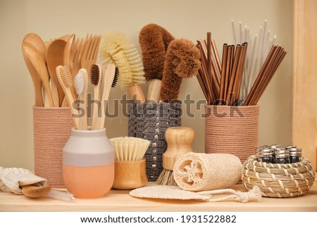 Collection of ecological household goods. Bamboo spoons, forks and toothbrushes. Eco-friendly coconut dishwashing brushes, round wooden dishwashing brushes, metal straws, loofah, natural shower 