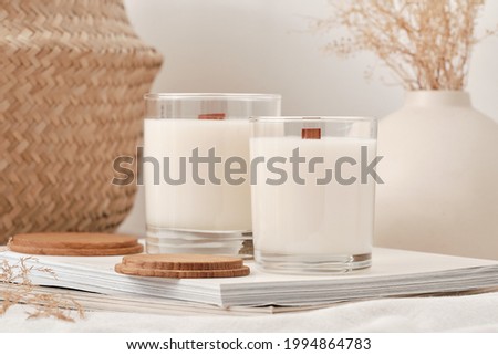 Handmade scented candles in a glass with a wooden lid. Soy wax candles with a wooden wick.